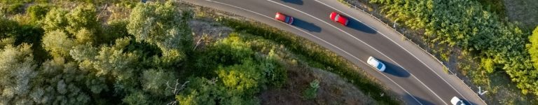 Traffic on a spanish road with cars driving seen from above aerial view